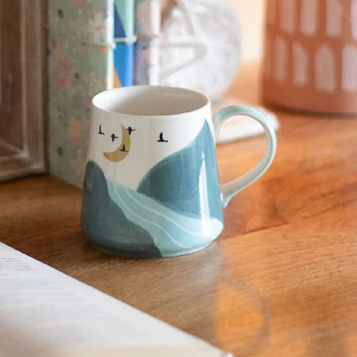 the-wishing-chair-wilderness-handpainted-ceramic-mug-teal-front-cover-view